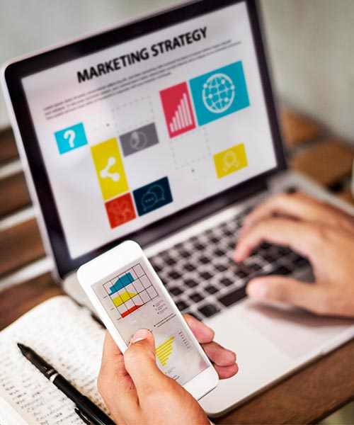 A person in athletic clothing sits on the gym floor after a workout, with a yellow kettlebell and a black water bottle in the foreground. The scene is set in a fitness studio with gym equipment in the background, capturing a moment of rest or recovery.